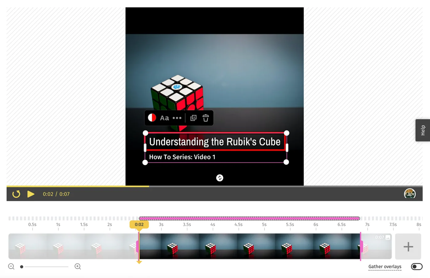 The timeline with a text overlay selected, its pink duration bar showing start and end handles